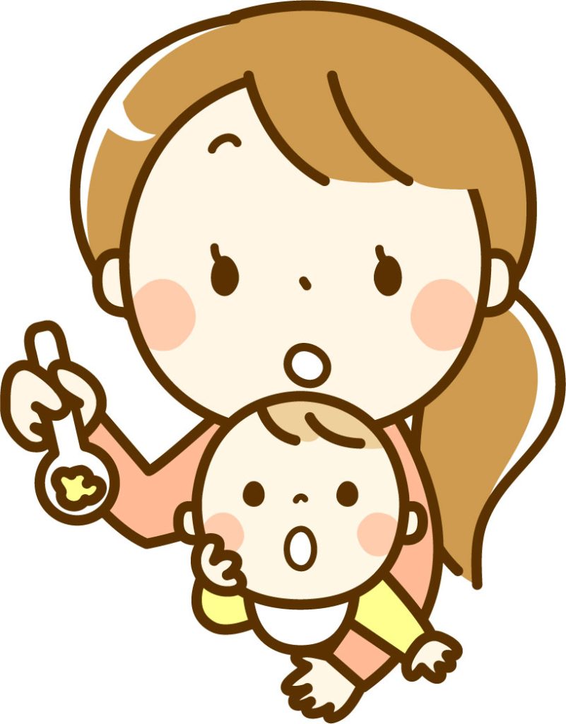 赤ちゃんに離乳食を与えるママ